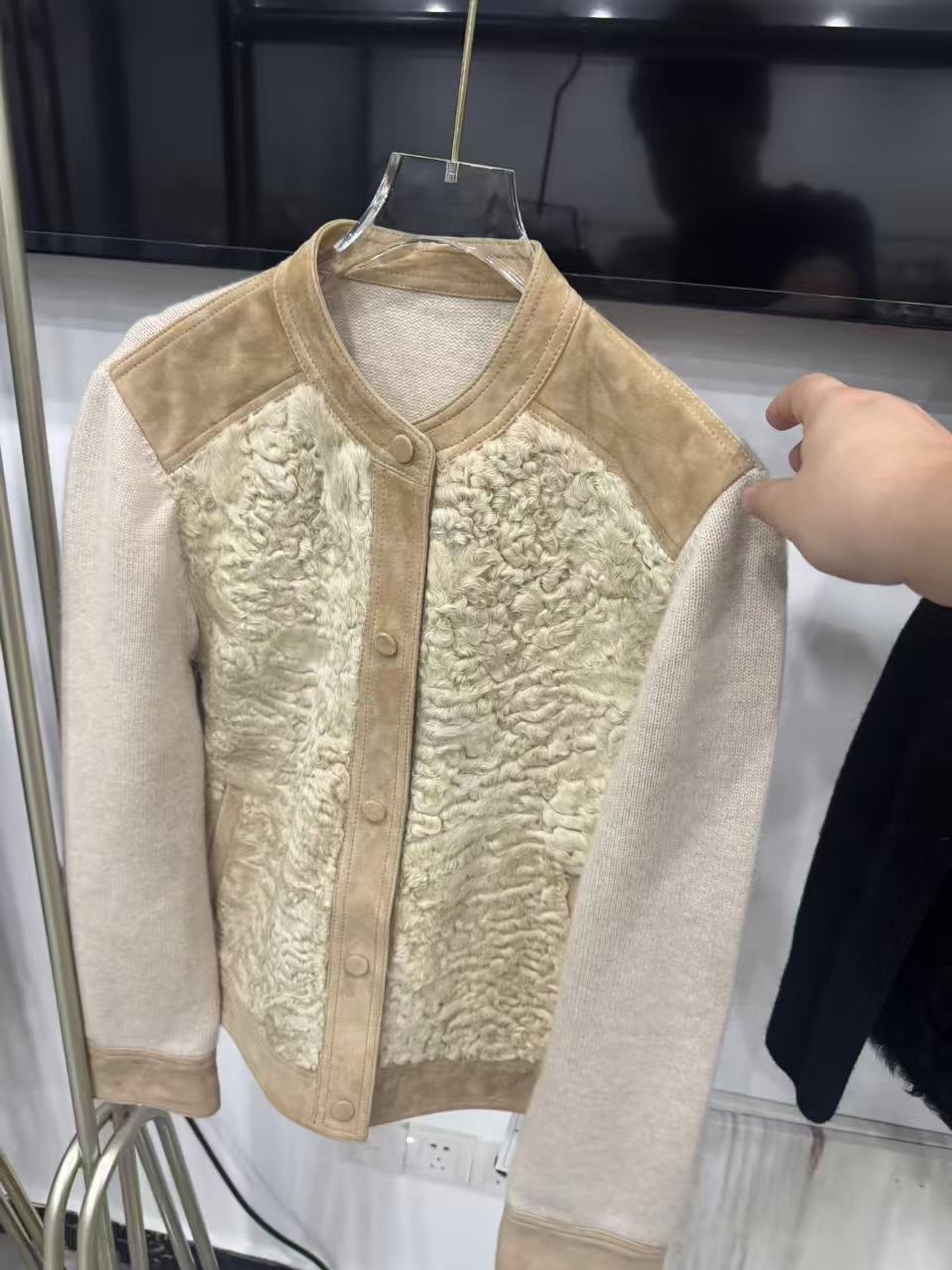 Light snap-front sample with knitted sleeves, a fur-like front panel and suede-like trim areas